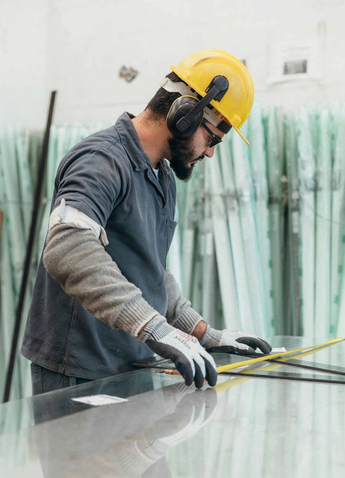 Industrial Worker Measuring Glass with Precision